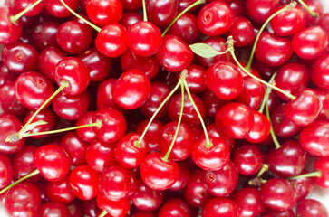 Ripe red cherries - background. Summer berries concept. Harvest. Horizontal orientation. Selective focus. Top view.