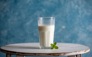  Glass Of Milk On White Wooden Table