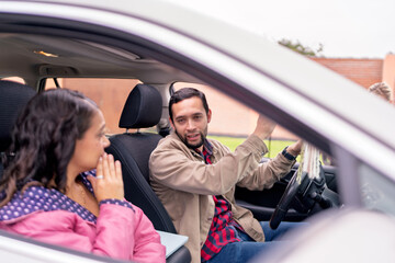 Couple experiencing car trouble during road trip