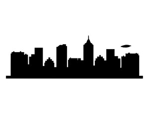 Obraz premium Black and white silhouette of a city skyline with a blimp