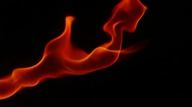 Abstract red flame on a black background. The flame has smooth curves and a glowing appearance, suitable for mockup designs and text space.