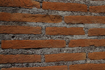 Ancient red bricks textured background wallpaper. Red bricks wall in Rome