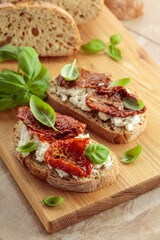 Ciabatta with sun dried tomatoes in olive oil, ricotta, and basil.