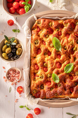 Tasty focaccia with cherry tomatoes and olive oil.