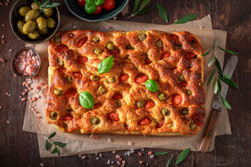 Homemade focaccia baked in rectangular baking tray.
