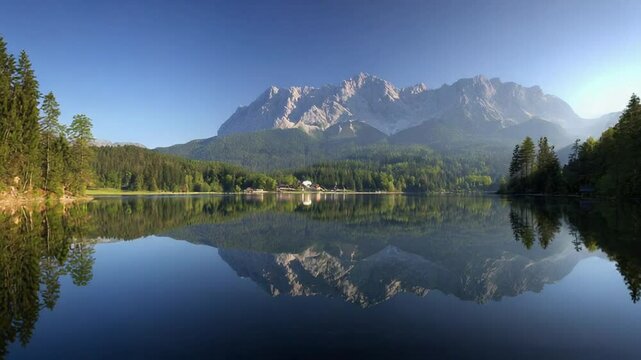 Lake Hintersee with reflections of the mountains and forests of Ramsau Bavaria