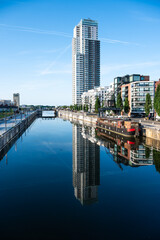 City reflections and skyline in the canal Brussels North, Belgium