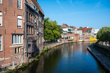Historical and renovated residential houses at the banks of the river Dyle in Mechelen, Antwerp Province, Belgium