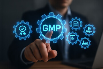 A person touching a gmp icon surrounded by other icons in a gear shape on a digital interface