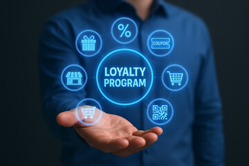 A person holding a loyalty program hologram with icons of gift, store, cart and qr code around it