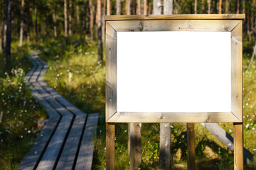 Blank sign along a wooden path in Finnish swamp