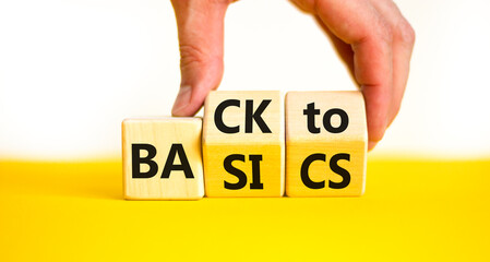 Back to basics symbol. Concept words Back to basics on wooden block. Beautiful yellow table white...