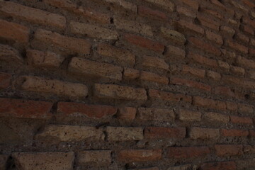 Ancient red bricks textured background wallpaper. Red bricks wall in Rome