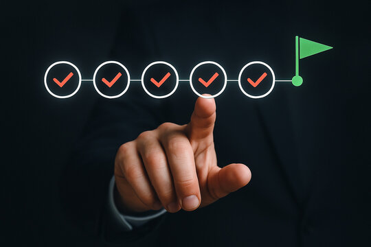 Hand touching a checklist with five red checkmarks and a green flag on a dark background - Powered by Adobe