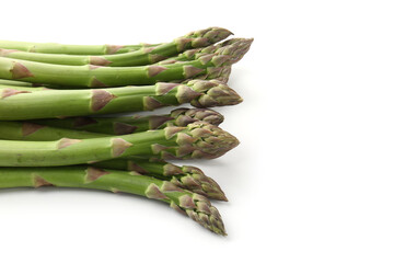 Fresh raw asparagus spears isolated on white