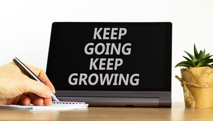 Keep going and growing symbol. Concept words phrase Keep going keep growing on beautiful tablet....