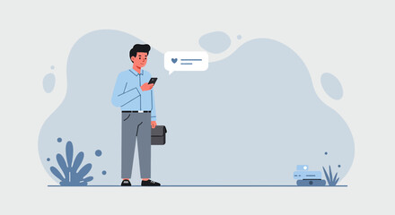 a man standing in front of a plant and using a phone