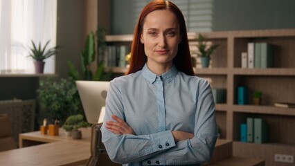 Businesswoman in office Caucasian girl posing crossed hands confident successful business woman...