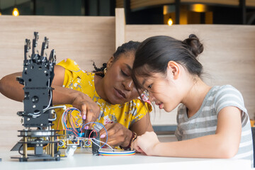 
Teacher woman and student girl smile think talking show idea project education learning technology...