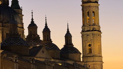 Majestic silhouettes of ancient cathedral towers at dusk, evoking twilight reveries, All Saints' Eve, architectural symphony in shadows