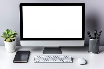 Fototapeta premium Modern Computer with White Screen, Succulent, Keyboard and Notepad on Desk