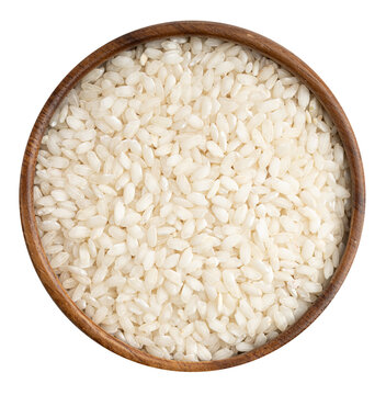 Parboiled rice macro in a wooden boul