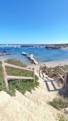 Scenic view of Tabarca Island, Spain, with turquoise waters, rocky coastline, and historic charm. A peaceful Mediterranean escape perfect for travel, snorkeling, and nature themes.