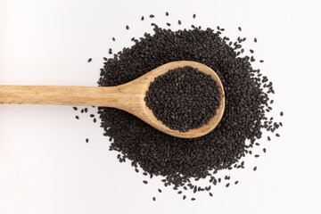 black sesame in spoon isolated