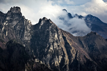 The peaks of the mounts Menderle and Ciore on the Pasubio massif. In the background the Sengio Alto. Vallarsa, Trentino, Italy.