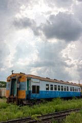 Vintage red diesel freight train on a rural railroad track