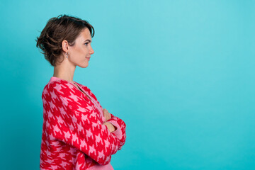 Photo portrait of pretty young girl profile crossed hands empty space wear trendy red outfit...