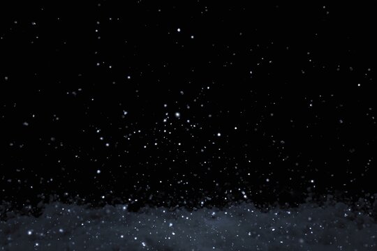 Falling Snowflakes Against Black Background