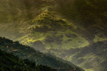 Sun rays falling on Himalayan mountain range, scenic beauty of layers of mountains, Okhrey, sikkim, India. Okhrey village a remote place in Sikkim where mountain range view is enjoyed by tourists.