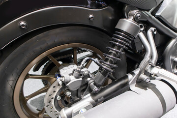 Obraz premium Disc brakes on a motorcycle up close alloy wheels for motorcycles robust steel wheel arches. Tires and wheels for motorcycles in chrome. ABS on motorbikes and disc brakes are safety devices.