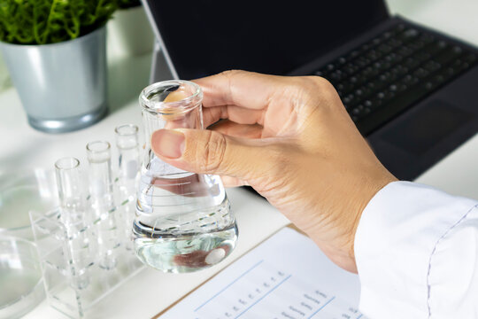 Researchers study data and conduct chemical experiments, in the creation of drugs, scientific data collection experiments