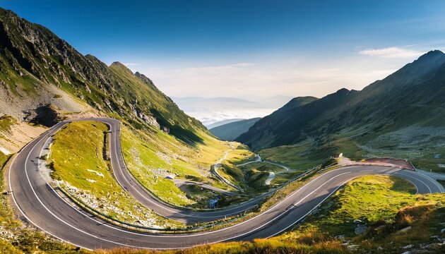 transfagarasan road winding near steep slope great outdoors of fagaras mountain ridge of romania in summer popular travel destination of europe on high altitude in morning light