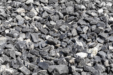 Medium sized rocks used in gardens or garden paths. Close-up focus view.