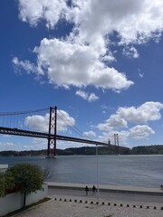 25 de Abril Bridge in Lisbon, Portugal, a striking red suspension bridge spanning the Tagus River. A landmark symbol of the city, often compared to San Francisco’s Golden Gate Bridge.