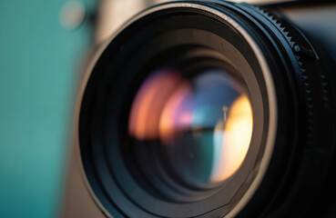 Macro shot of vintage camera lens with warm light reflection. Old photo equipment, optic details. Focus on glass with reflections. Classic tech, photography, retro, film camera.
