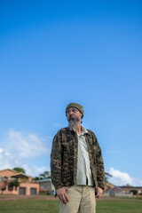Portrait of man seen standing outdoors
