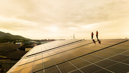 technician installs a large photovoltaic system on an industrial rooftop. ESG investment, and the future of sustainable technology powered by AI energy management and next generation solar cells.