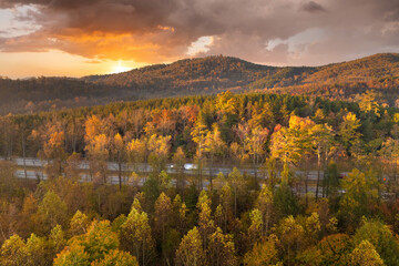 American highway in North Carolina Appalachian mountains in fall season with fast moving traffic....