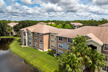 Florida neighborhood with multi-unit condos, showcasing suburban real estate development and modern...