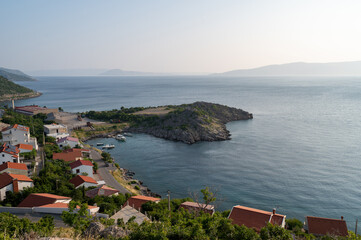 A bay on the edge of the small fishing village of Sveti Juraj, with a small island, on the Adriatic coast, at the foot of the Velebit Mountains in Croatia