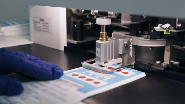 This image shows a laboratory scene, likely focused on medical procedures, with a person in the act of blood collection. Taking a Blood Sample in Lab