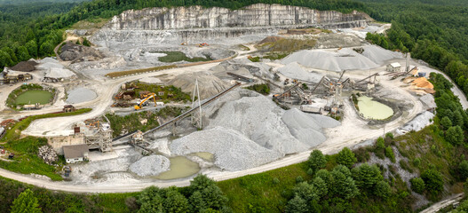Sand open-pit mining quarry with processing plant for crushed stone. Extracting of natural...