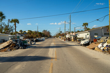 Street-side heaps of storm debris left behind by Hurricane Milton on Manasota Key in Englewood,...