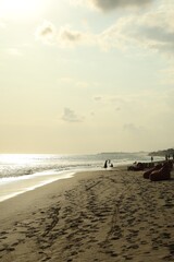Beautiful view of sea and people relaxing on sandy beach