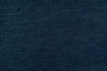 Close-up Texture of Dark Blue Denim Fabric Ideal for Fashion and Textile Backgrounds