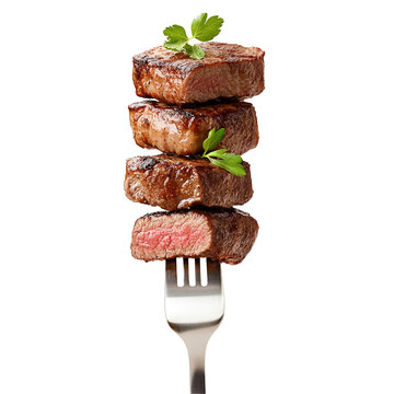 Delicious grilled steak pieces on a fork garnished with parsley